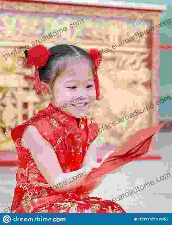 Baby Wearing Traditional Chinese Clothing And Holding A Red Envelope During Chinese New Year Baby S First Chinese New Year